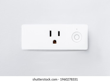 Modern Smart Plug And Wifi Outlet. Minimal Design Of Electricity With On Off Control Switch For Save Energy On A Wall. Inactive Electric Power Device Installed On White Background.