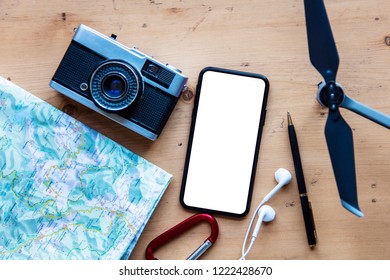 Modern smartphone with travel items. Blank screen phone display - Shutterstock ID 1222428670
