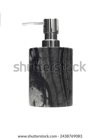  A modern soap dispenser with a sleek design, featuring a marbled black and white body and a shiny metallic pump, isolated on a white background. It exudes elegance and is indicative of a contemporary