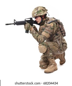 Modern Soldier With Rifle Isolated On A White Background