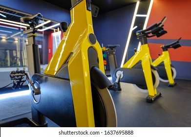 Modern Spinning Class, Gym With Indoor Bikes In A Row