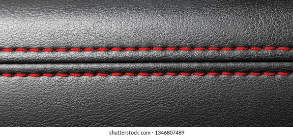 Modern Sport Car Black Leather Interior. Part Of Leather Car Seat Details With Red Stitching. Car Detailing.