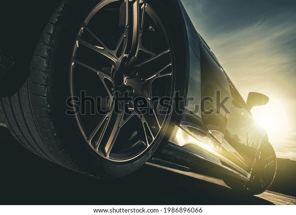 Modern Sport\
Performance Car During Scenic Sunset. Road Level View.\
Transportation and Automotive\
Theme