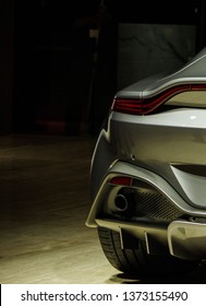 Modern sports car tail light and exhaust pipe rear view