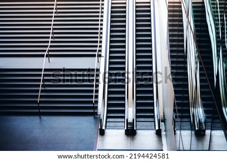 Modern stairway electric escalator of subway, indoor interior and facility building, empty stairs.
