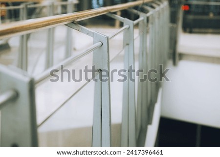 Modern stairway with sleek metal balustrades and wooden handrail, a symbol of contemporary urban architecture Imagine de stoc © 
