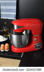 Modern Stand Mixer And Ingredients On Countertop In Kitchen. Home Appliance