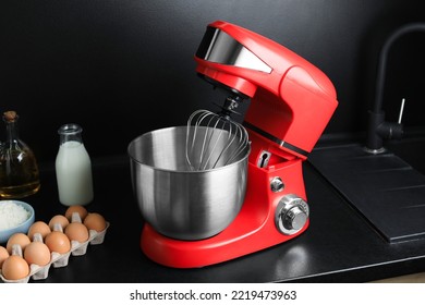 Modern Stand Mixer And Ingredients On Countertop In Kitchen. Home Appliance