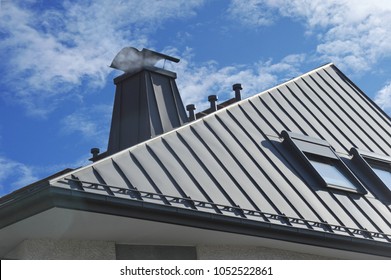 Modern Standig Seam Metal Roof with Roof Window, Fume Hoods, Snow Guard, rain Gutter and Metal plastered Chimney