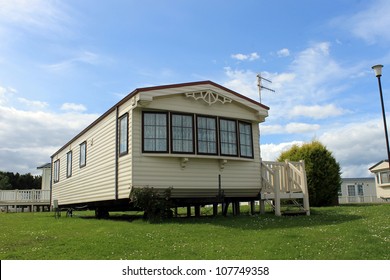 Modern static caravan on campsite during summer, holiday or vacation scene.