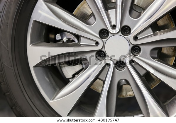 Modern steel car wheel with\
new tyre