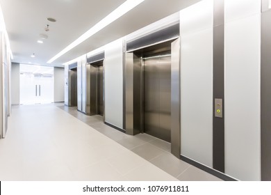 Modern Steel Elevator All Closed Cabins In A Business Lobby Or Hotel, Store, Interior, Office,perspective Wide Angle. Three Elevators In Hotel Lobby.