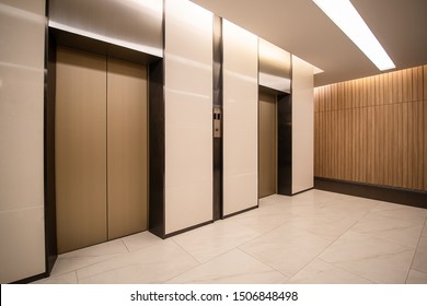 Modern steel elevator cabins in a business lobby or Hotel, Store, interior, office,perspective wide angle. Three elevators in hotel lobby