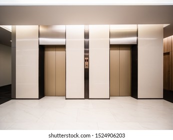 Modern Steel Elevator Cabins In A Business Lobby Or Hotel, Store, Interior, Office,perspective Wide Angle. Three Elevators In Hotel Lobby