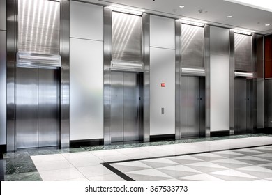  Modern Steel Elevator Cabins In A Business Lobby