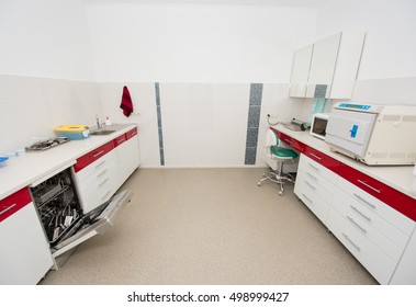 Modern Sterilization Room For The Handling Of Dental Instruments. Built-in Washer Machine, Packaging Machine, Ultraviolet Shelf, Sterilizer, Autoclaving.