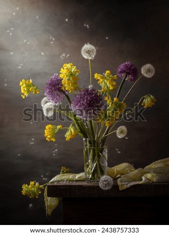 Modern still life with a bouquet of wildflowers on a dark background.