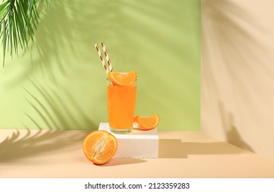 Modern still life with citrus fruits, orange juice and oranges on a pastel background with long hard shadows, minimal detox diet concept, summer vitamin drinks, selective focus, - Shutterstock ID 2123359283
