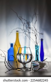 Modern still life with glass bottles and dry branches. - Shutterstock ID 2254682245