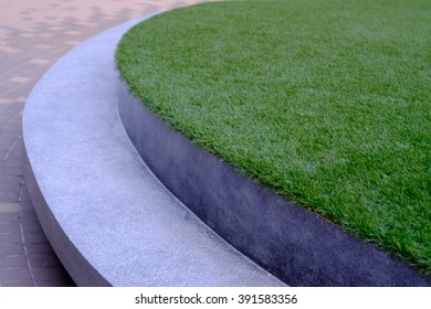 Modern Stone Bench In The Garden Beside The Road, Concrete Bench, Cement Bench, Grass On Top View, Select Focus With Shallow Depth Of Field.