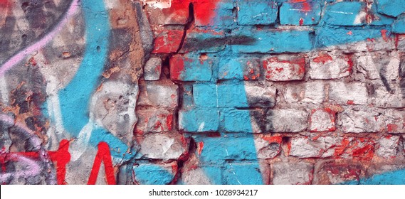 Modern Street Art Background Or Texture. Grunge Brick Wall With Graffiti Art. Urban Surface With Grafiti. Old Building Brickwall With Modern Street Grafitti Art Fragment. Abstract Web Banner