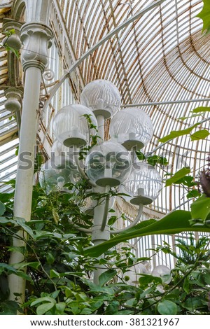 Modern street lamp inside the greenhouse against  the plants. Belfast, Northern Ireland