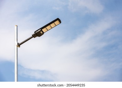 A Modern Street LED Lighting Pole. Urban Electro-energy Technologies. Poles On The Road With LED Light. Outdoor Lighting Strong LED Lamp. 