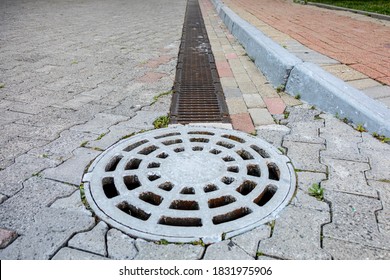 Modern Street Pavement Made Of Paving Stones And Storm Water Drain System. Perspective View. Storm Drainage System.