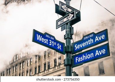 Modern street sign and vapor steam in New York City - Urban concept and road traffic directions in Manhattan downtown - American world famous capital destination on dramatic desaturated filtered look