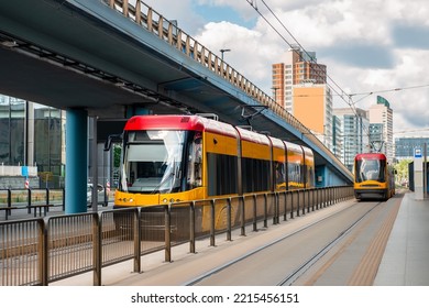 Modern Streetcar Near Tram Stop On Sunny Day. Public Transport