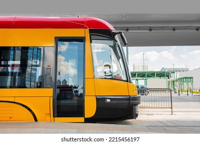 Modern Streetcar Near Tram Stop On Sunny Day. Public Transport