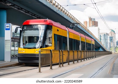 Modern Streetcar Near Tram Stop On Sunny Day. Public Transport