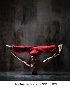 modern style dancer posing on dirty grunge background