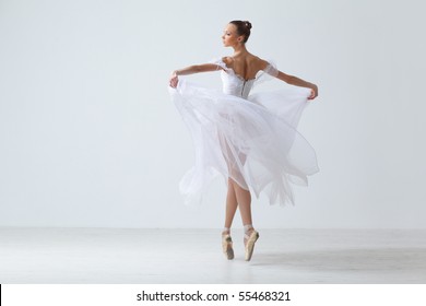 modern style dancer posing on studio background