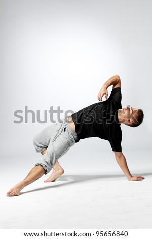 Similar – Mexican yoga teacher practicing side angle pose