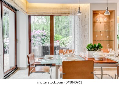 Modern style dining room with large windows  Stock Photo
