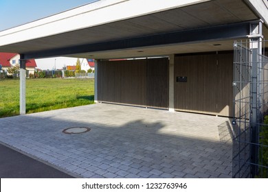 modern style garage and carport on fall sunshine day in south germany bavaria