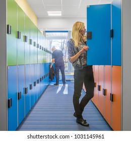 Modern Style University Interior With Colorful Lockers In Hallway