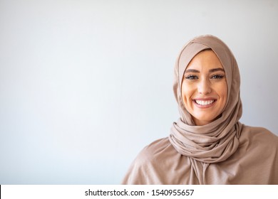 Modern, Stylish And Happy Muslim Woman Wearing A Headscarf. Arab Saudi Emirates Woman Covered With Beige Scarf. 