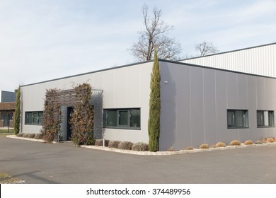 Modern Suburban Low Rise Office Building Under Blue Sky