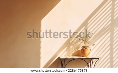 Modern summer minimal of olive tree on table in sunlight with long shadows on beige wall background, copy space interior lifestyle Mediterranean scene