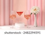 Modern summer still life with alcoholic cocktail Aperol spritz, champagne, pink martini and peony flowers on elegant modern background, minimal concept for bar and holiday party, cafe,  banner