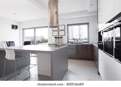 Modern and sunny kitchen with kitchen island in the middle - Shutterstock ID 300936689