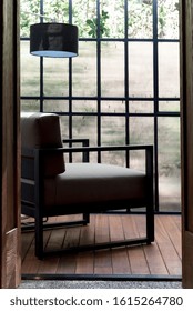 Modern Sunroom With Black Chair