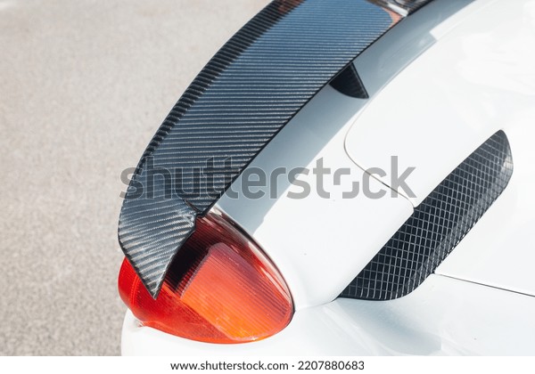 Modern supercar\
carbon spoiler wing at the\
trunk