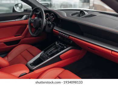 Modern Supercar Interior With The Leather Panel, Sport Seats, Multimedia, And Digital Dashboard. View From The Passenger Seat To Sports Car Cockpit Wide Angle