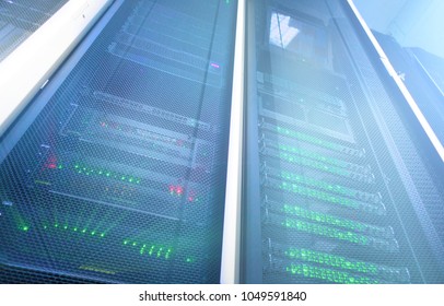 Modern supercomputers in computational data center. multiple exposure. Server room in data center full of telecommunication equipment. internet. big data storage. 