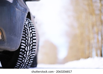 Modern Suv Car Stay On Roadside Of Winter Road. Family Trip To Ski Resort Concept. Winter Or Spring Holidays Adventure. Car On Winter Snowy Road In Mountains