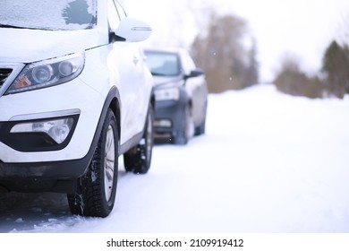 Modern Suv Car Stay On Roadside Of Winter Road. Family Trip To Ski Resort Concept. Winter Or Spring Holidays Adventure. Car On Winter Snowy Road In Mountains