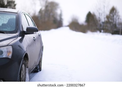 Modern Suv Car Stay On Roadside Of Winter Road. Family Trip To Ski Resort Concept. Winter Or Spring Holidays Adventure. Car On Winter Snowy Road In Mountains